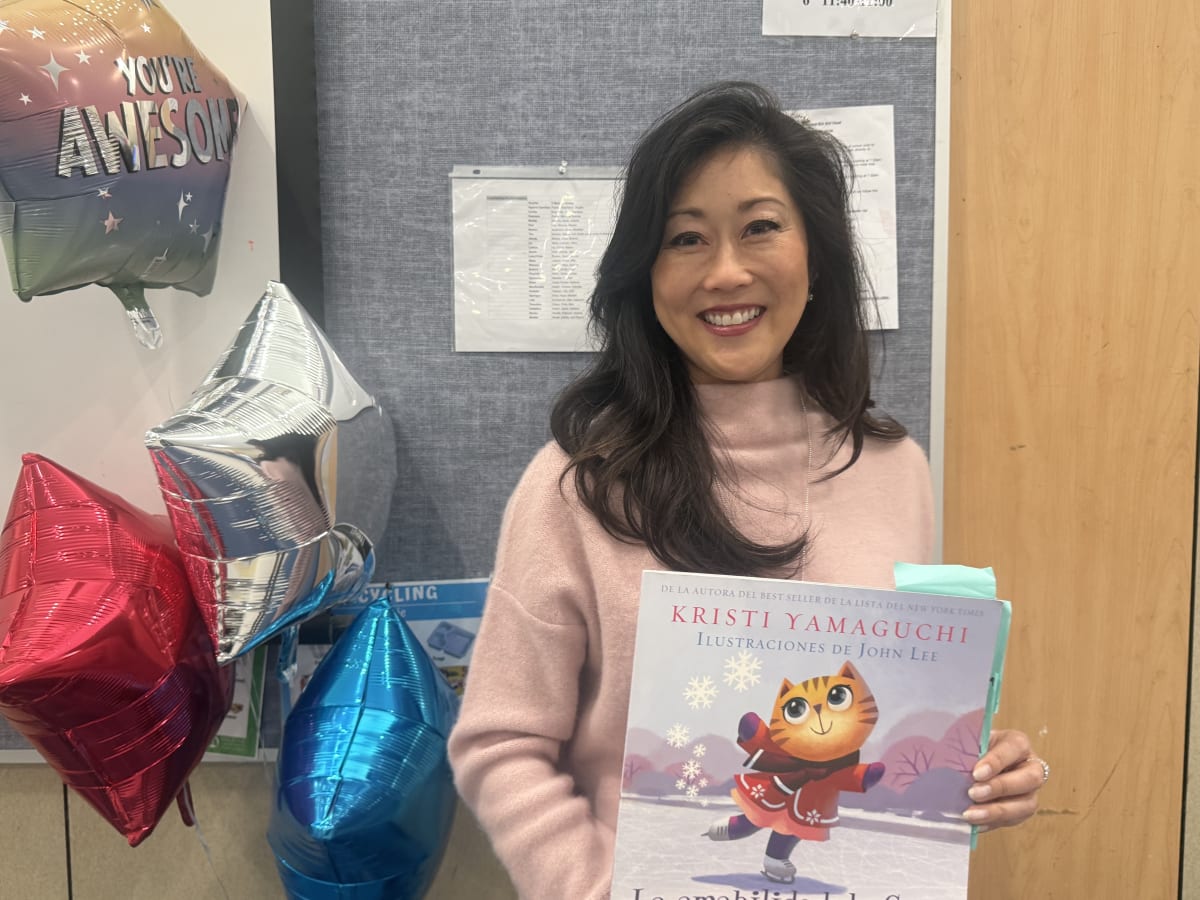 Olympic Gold Medalist Brings Books to 6,000 Kids Yearly