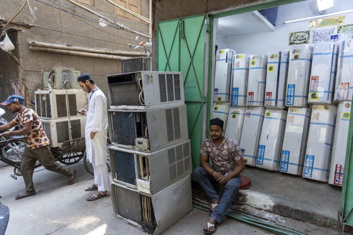 Air conditioning unit being installed in Indian home during summer heat