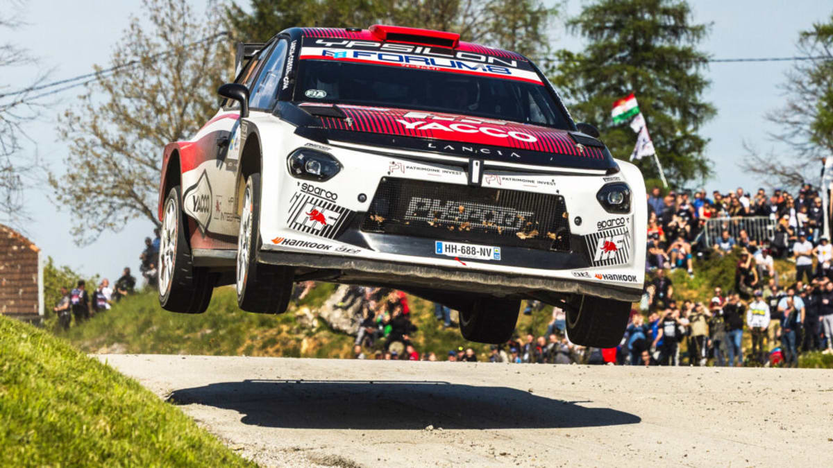 Lancia Ypsilon rally car racing through Croatian roads at World Rally Championship