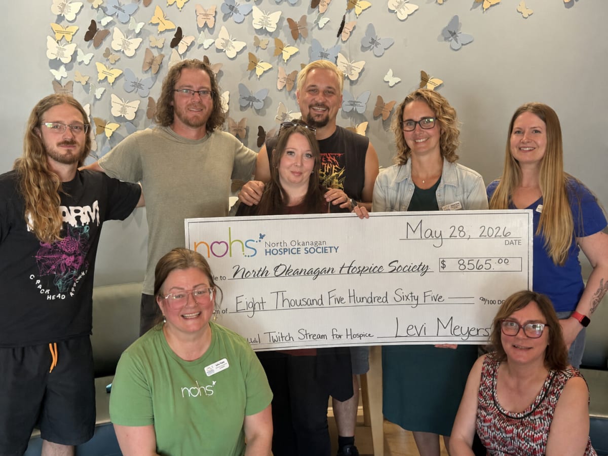 Man streaming video games on computer to raise money for hospice care organization