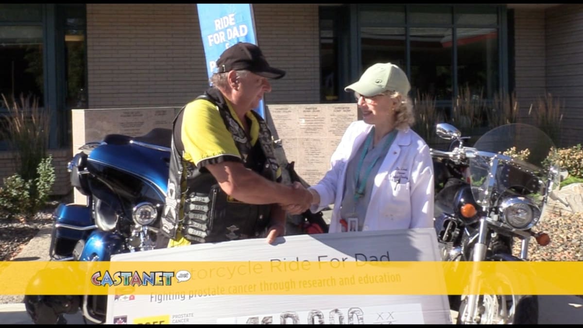 Bob Charron presenting large check for prostate cancer research at BC Cancer Centre Kelowna