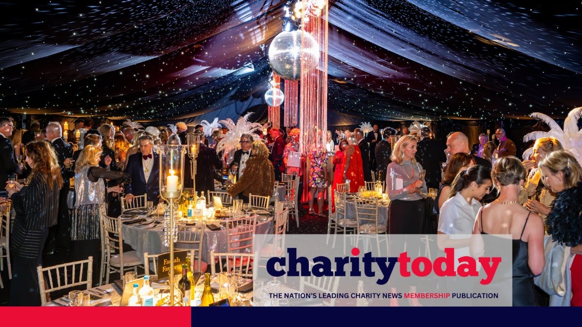 Clare and Guy Schwinge smiling together at their record-breaking cancer charity fundraising event