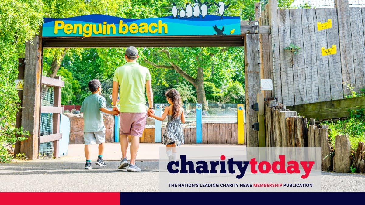 Fathers and children enjoying outdoor activities together at London Zoo during special Father's Day celebration