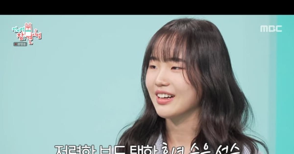 Yu Seung-eun performing aerial snowboard trick during 2026 Milan Winter Olympics competition