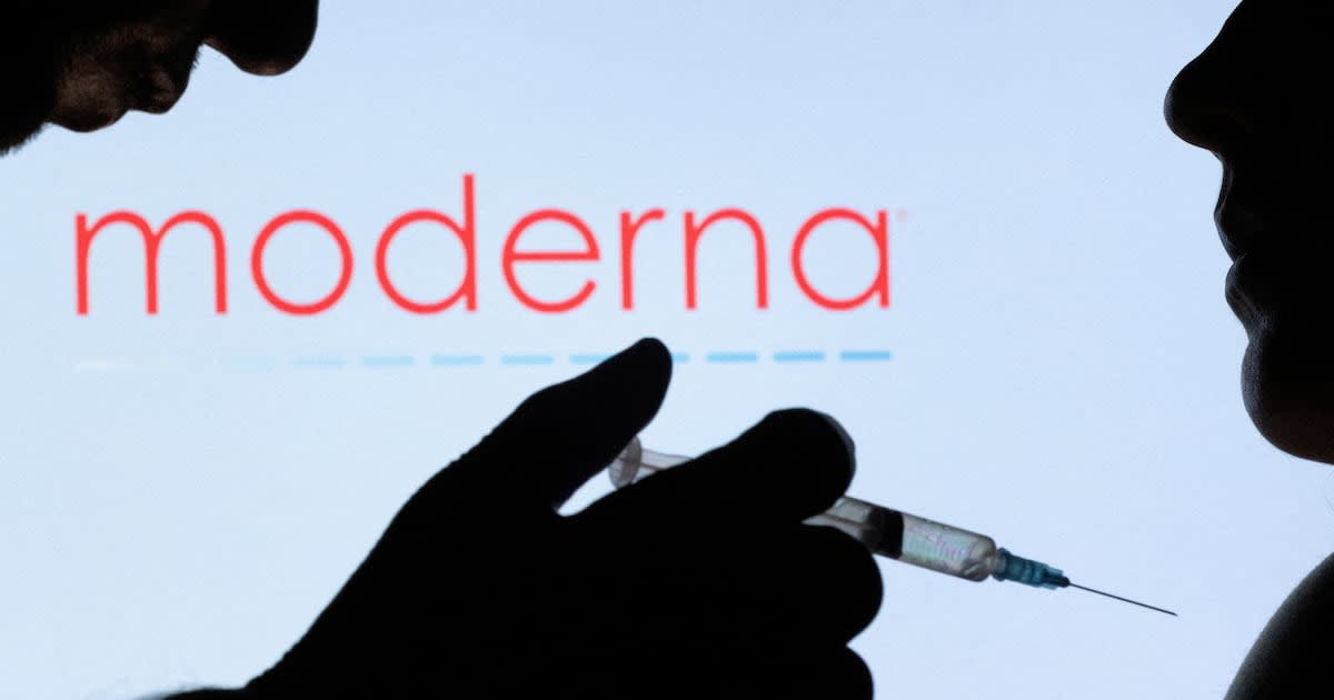 Medical researcher holding vial of personalized mRNA cancer vaccine in modern laboratory setting