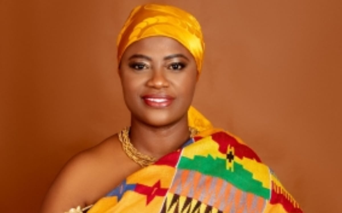 ** Professor Jane Naana Opoku-Agyemang smiling in formal attire at Ghana's presidential inauguration ceremony