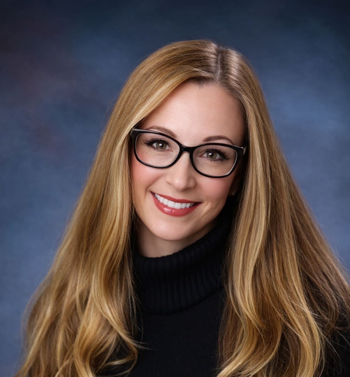 High school students presenting business pitch on stage at University of Colorado Boulder competition