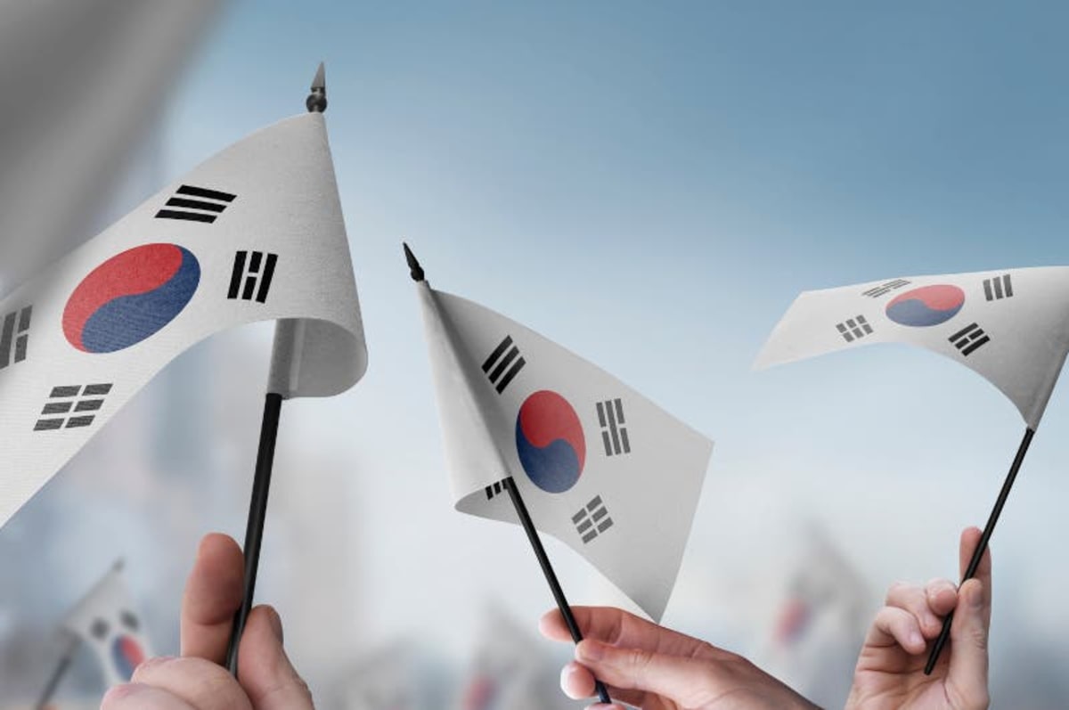 South Korean flag with digital AI interface representing nationwide artificial intelligence access program