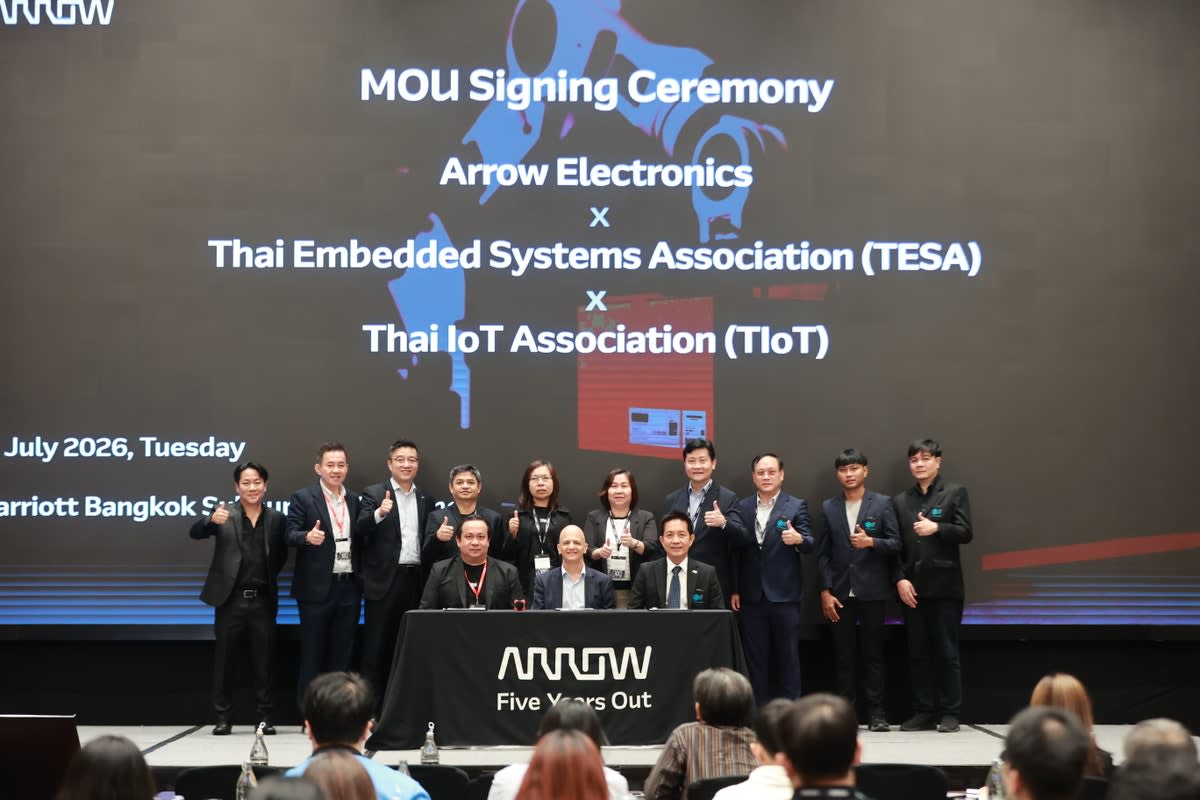 Engineers collaborating on advanced technology projects in modern Thai innovation workspace