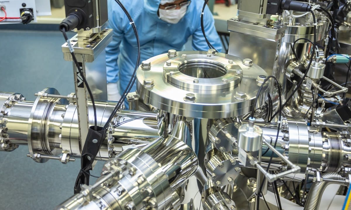 Small quantum battery prototype device in clean laboratory showing multi-layered organic microcavity structure