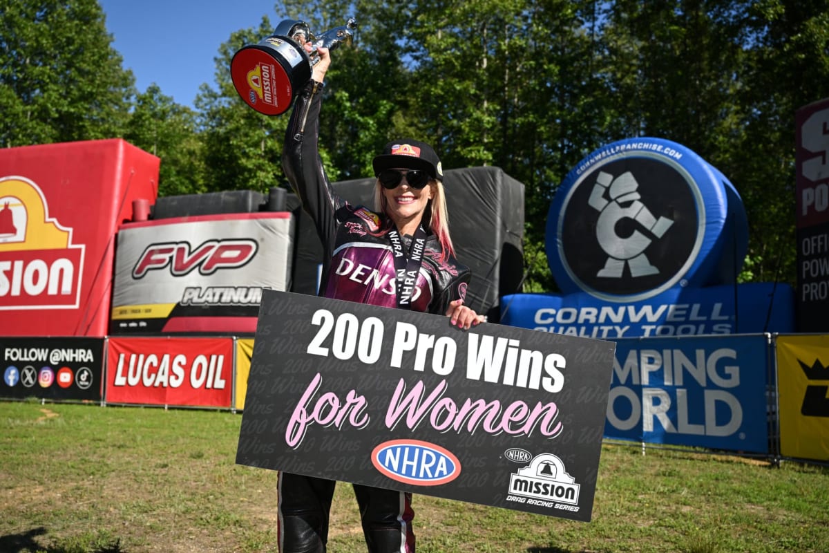 Angie Smith racing her DENSO-sponsored Buell motorcycle down the drag strip at NHRA Potomac Nationals