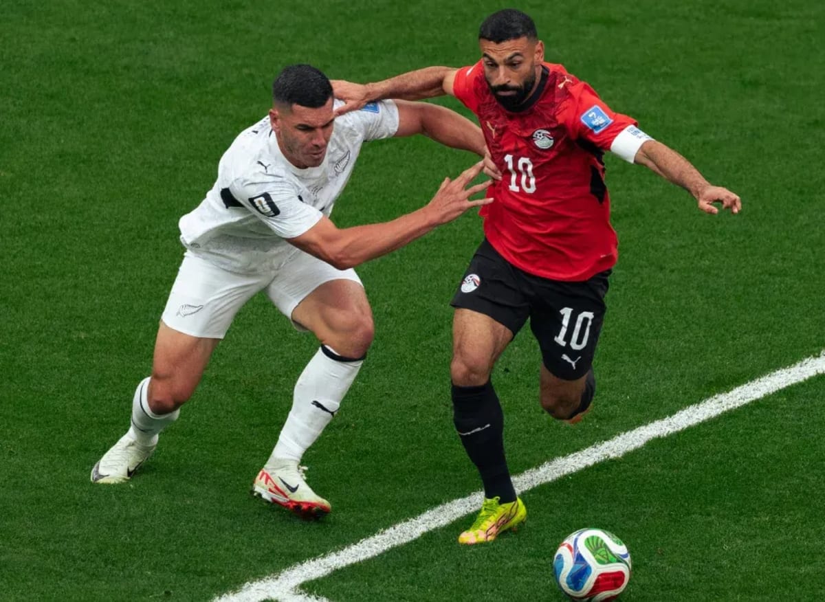 Egyptian football captain Mohamed Salah competing for the ball during historic World Cup victory