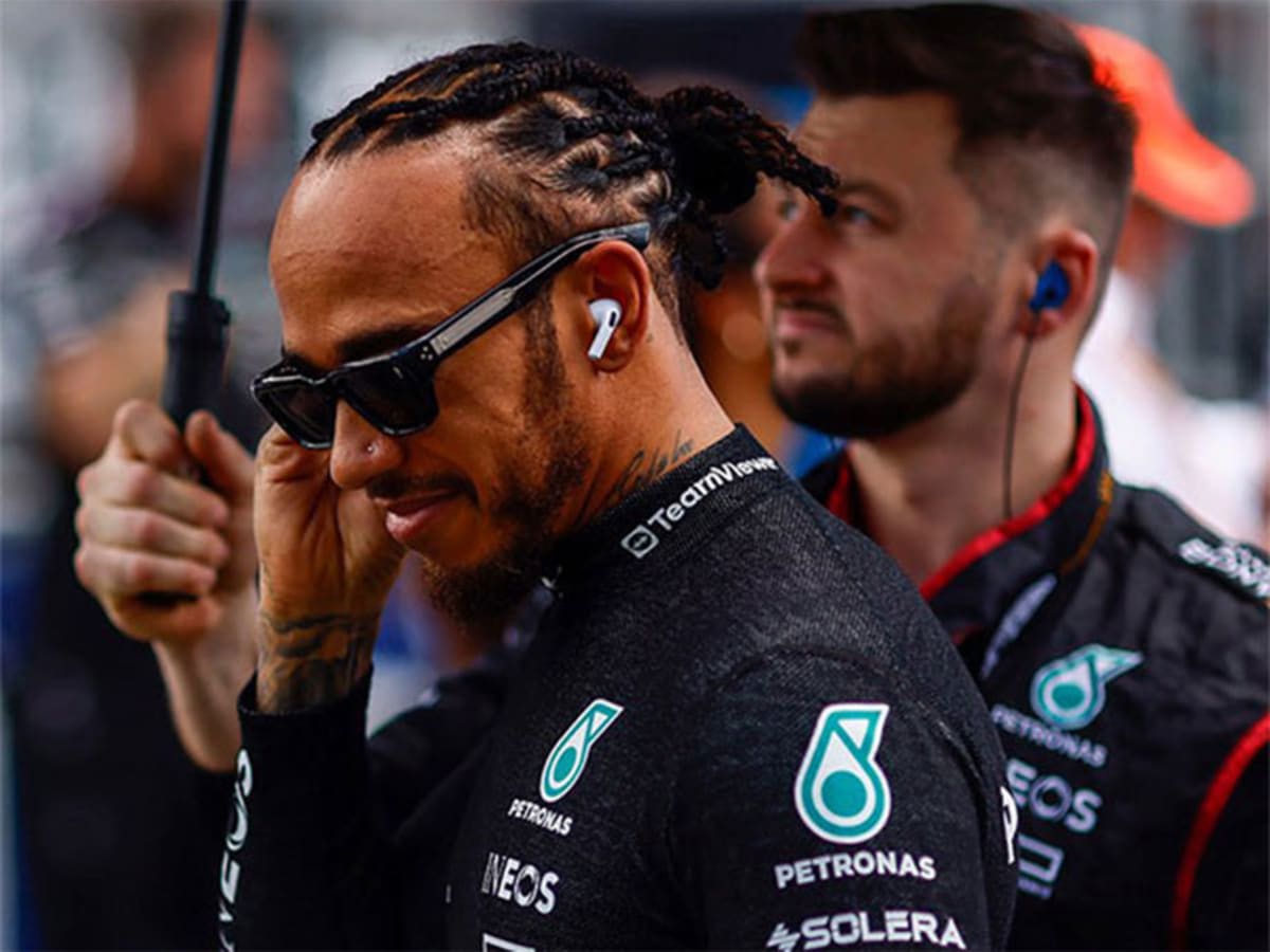 Lewis Hamilton celebrating in Ferrari racing suit after winning Barcelona-Catalunya Grand Prix