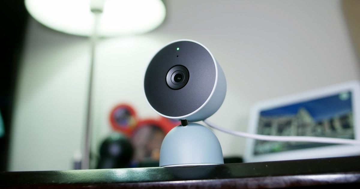 Smartphone with LED case attachment scanning hotel room object for hidden cameras