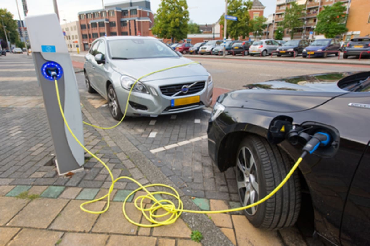Modern electric vehicle charging at station, representing growing accessibility of sustainable transportation