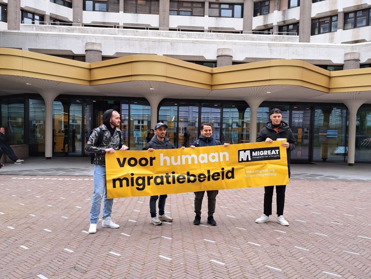 Diverse group of workers in professional setting welcoming new colleague in Netherlands workplace