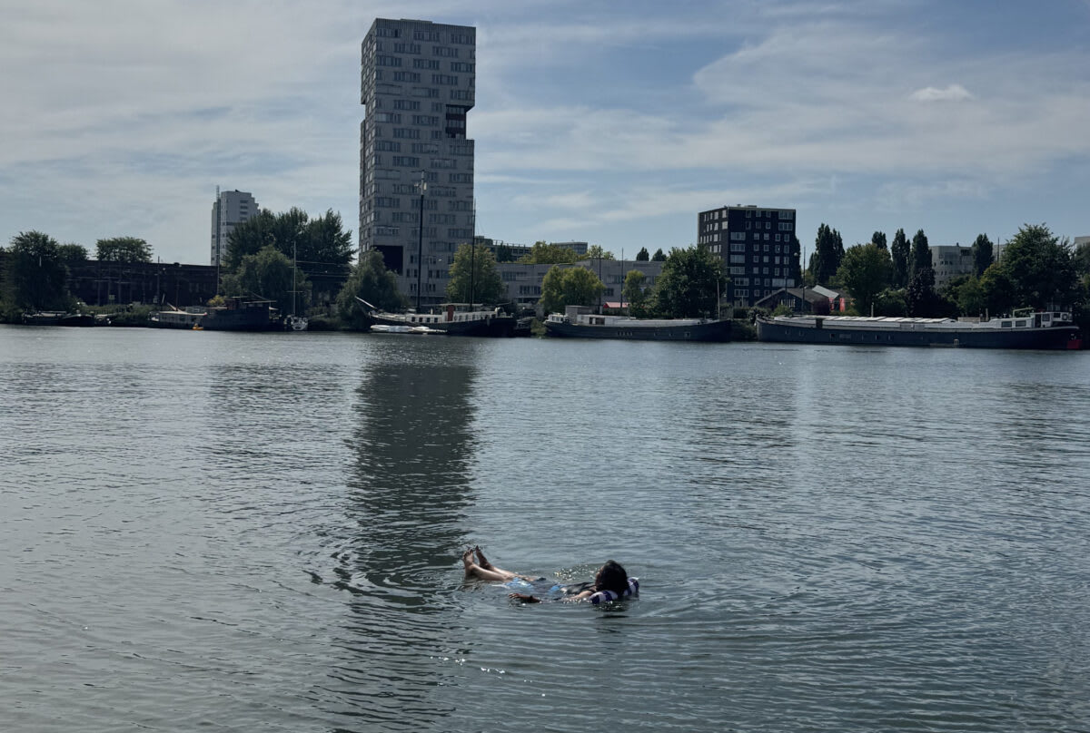 ** Woman with multicultural background smiling in Amsterdam, connecting to her Dutch colonial roots