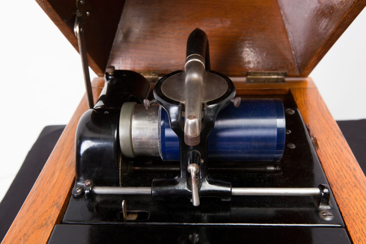 Antique phonograph cylinder player from early 1900s with brass horn speaker
