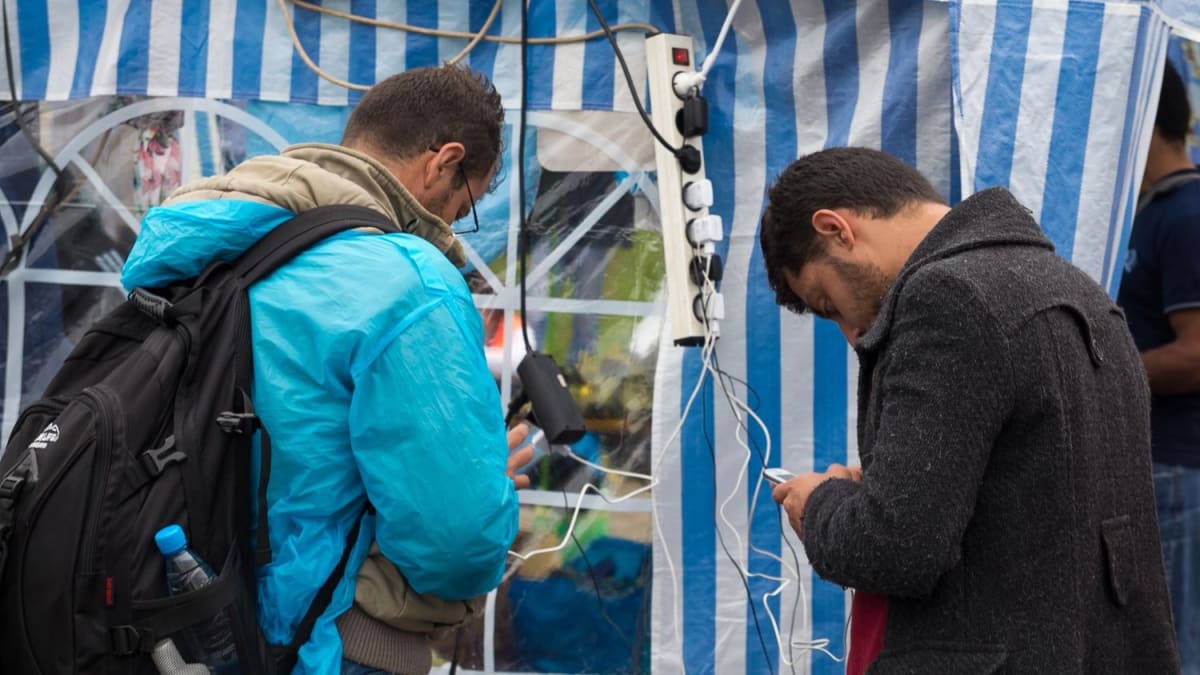 Person holding smartphone with privacy and legal scales symbolizing digital rights protection