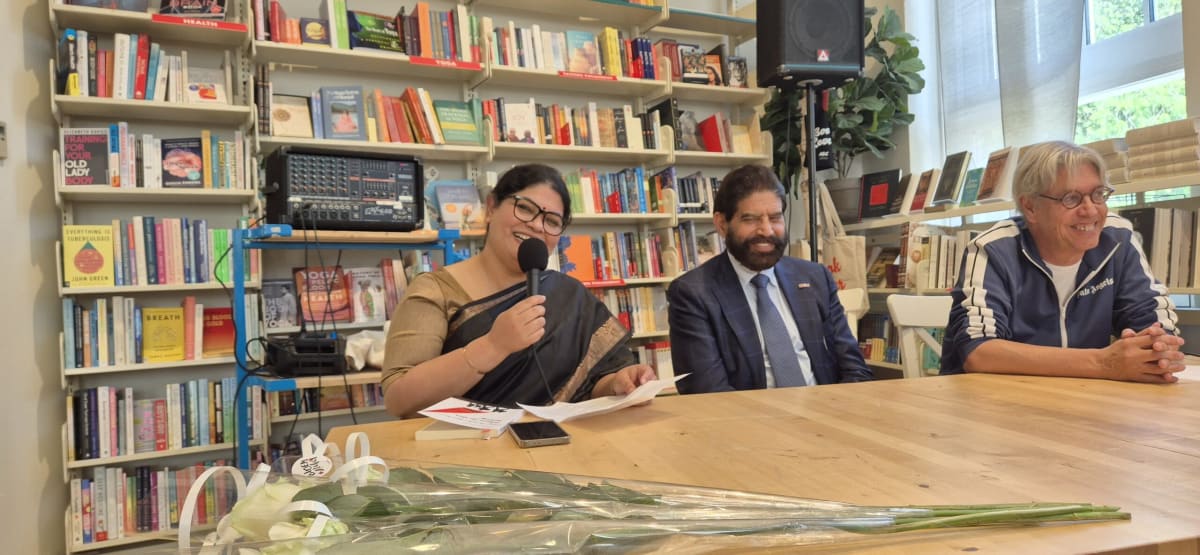 Author Satarupa Bose Roy speaking at book launch event in Amsterdam bookstore
