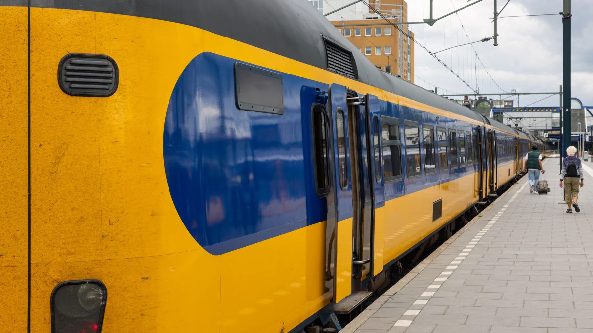 Modern Dutch train at platform ready for passengers to board for affordable travel