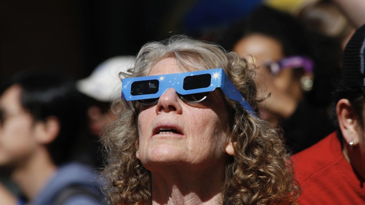 Partial solar eclipse over the Netherlands showing moon blocking most of sun's light