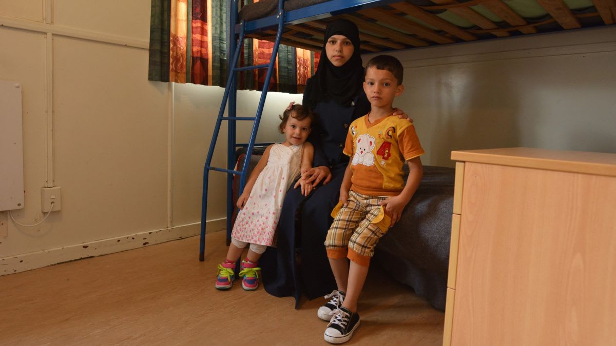 Young children receiving healthcare check-up from medical professional in welcoming clinic setting