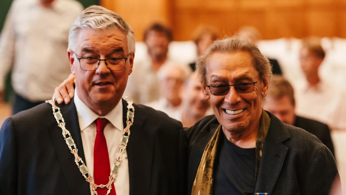 Alex van Halen receiving knighthood medal from Nijmegen mayor Hubert Bruls at ceremony