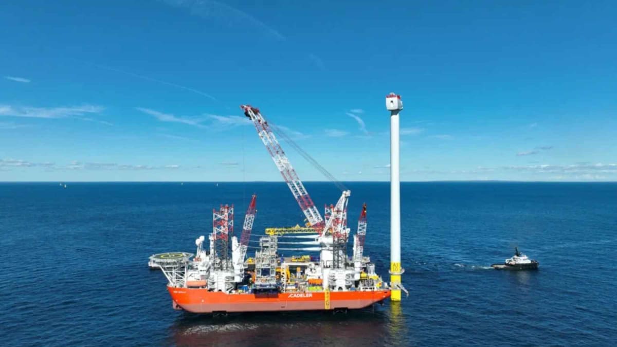 Offshore wind turbines rising from Atlantic Ocean waters off Long Island coast