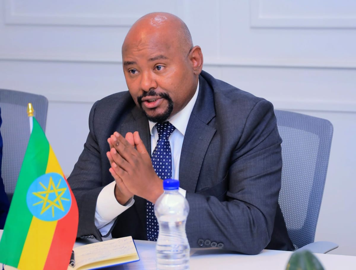 Ethiopian and Benin government ministers shaking hands during digital technology cooperation meeting in Addis Ababa