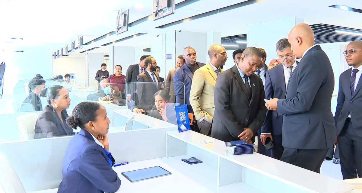 Modern government service center in Ethiopia with digital kiosks and citizens receiving assistance