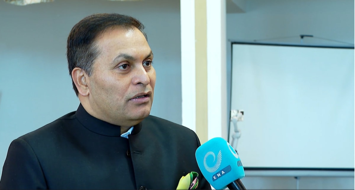 Green landscape with newly planted tree seedlings across Ethiopian countryside under blue sky