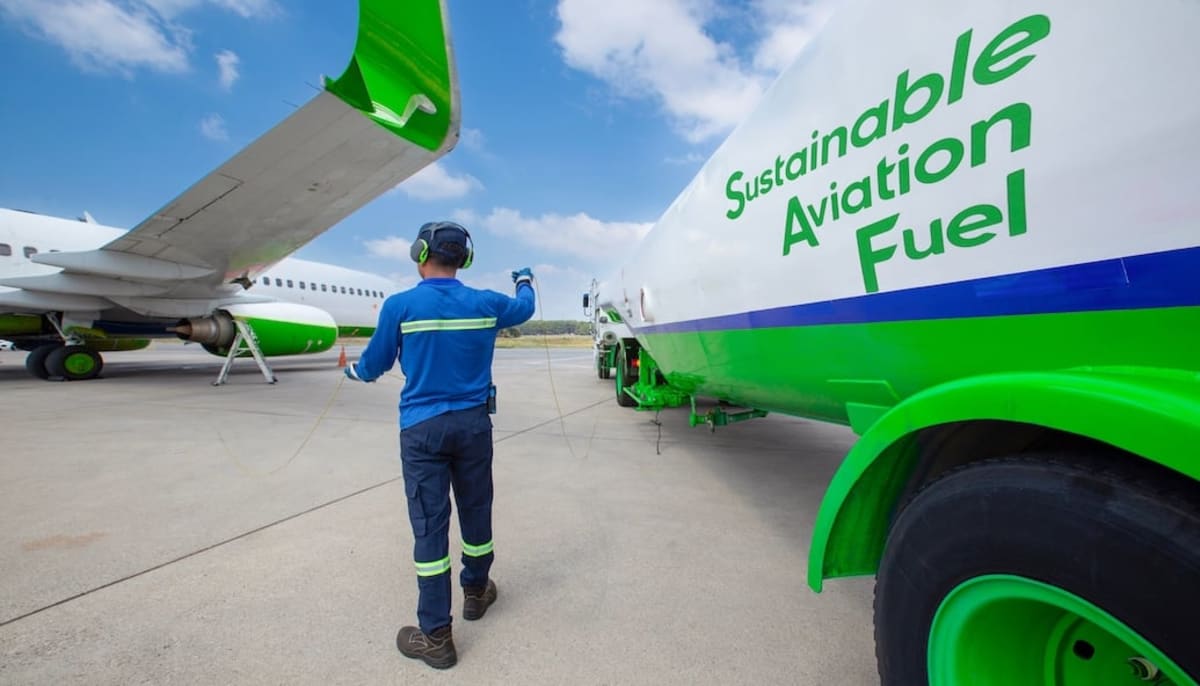 Scientists analyzing sustainable aviation fuel samples in modern university laboratory testing facility