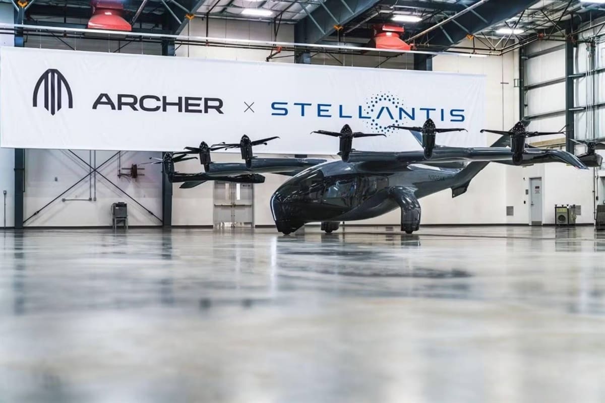 Sleek electric vertical takeoff aircraft concept hovering above futuristic city skyline
