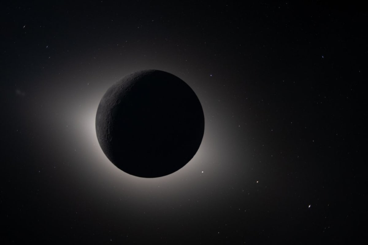 Sun eclipsed by Moon photographed from Artemis II spacecraft with Saturn and Mars visible