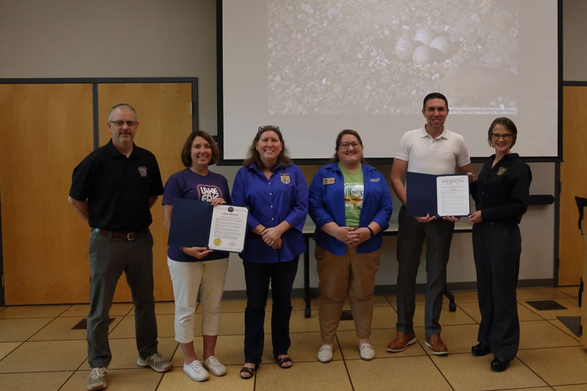 Conservation officials gather at ceremony celebrating 10 years of endangered piping plover nesting success