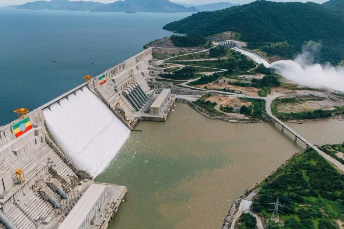 Aerial view of the Grand Ethiopian Renaissance Dam reservoir in highland gorge surrounded by green landscape