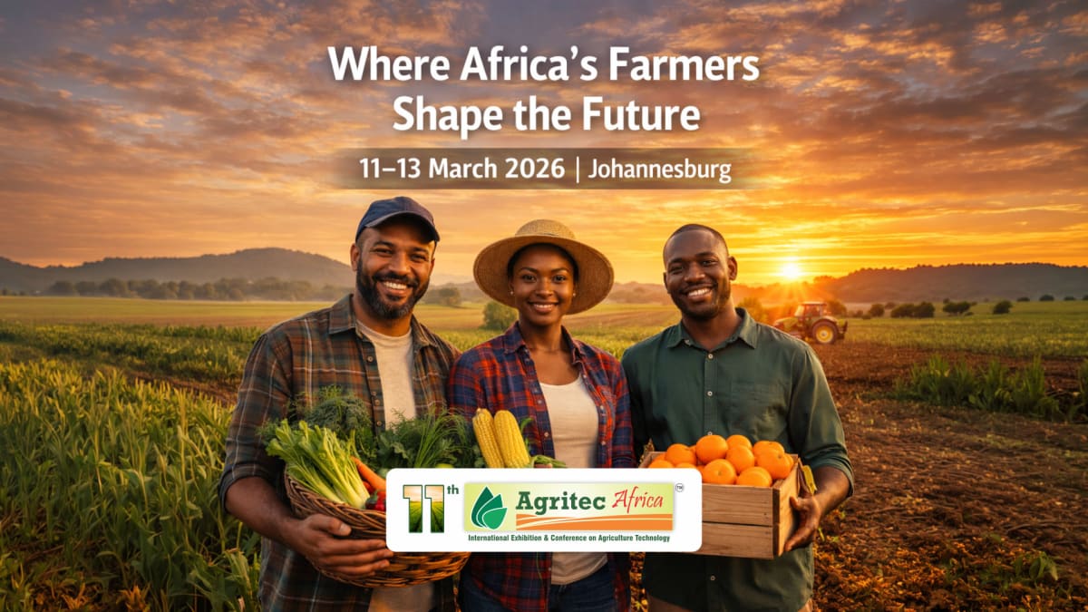 ** African farmer examining modern irrigation equipment in green crop field under sunny sky