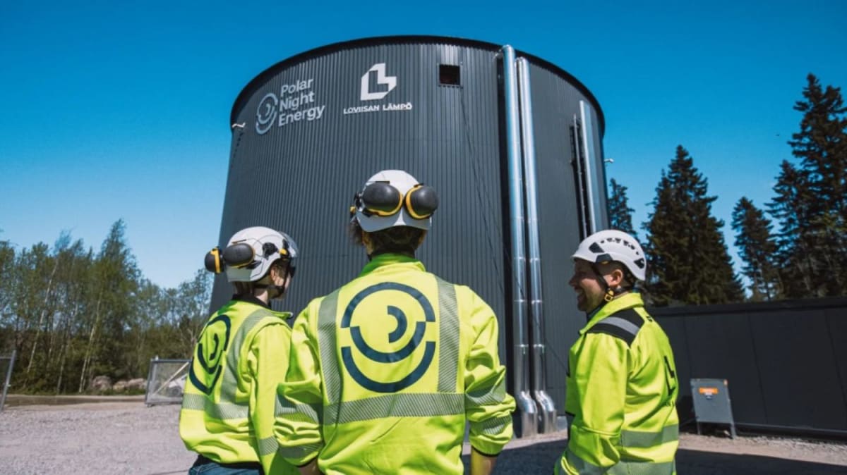 Large steel industrial silo containing crushed soapstone thermal energy storage system in Finland