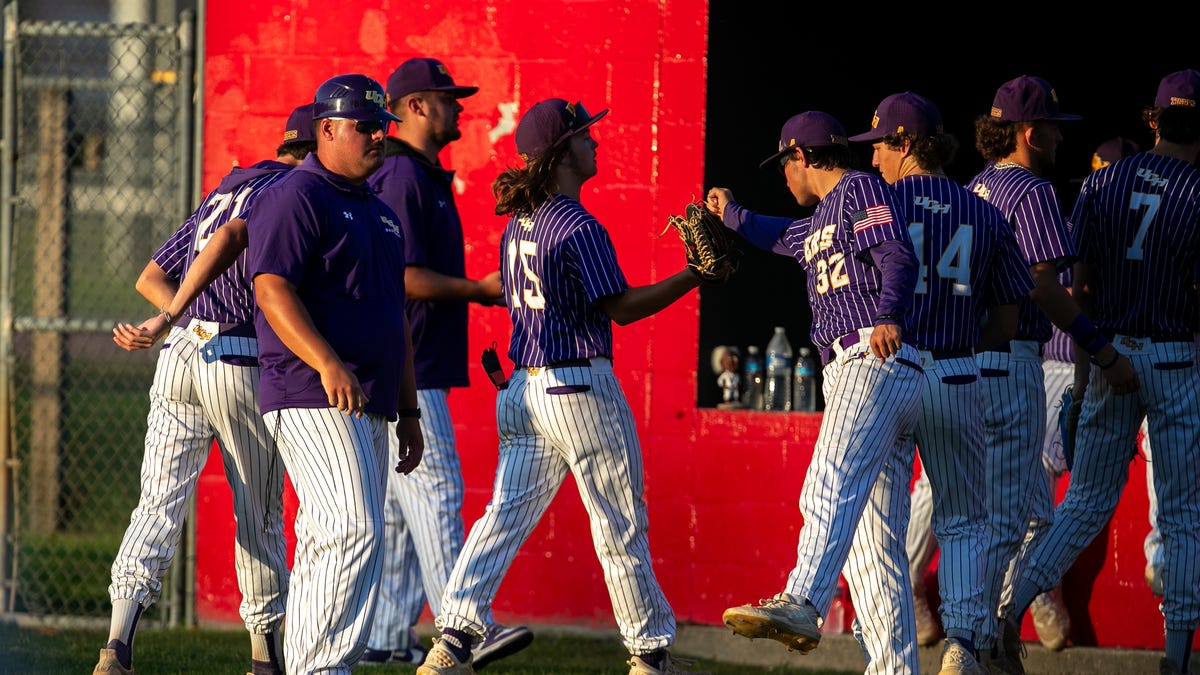 Union County baseball team celebrating their come-from-behind state championship victory on the field