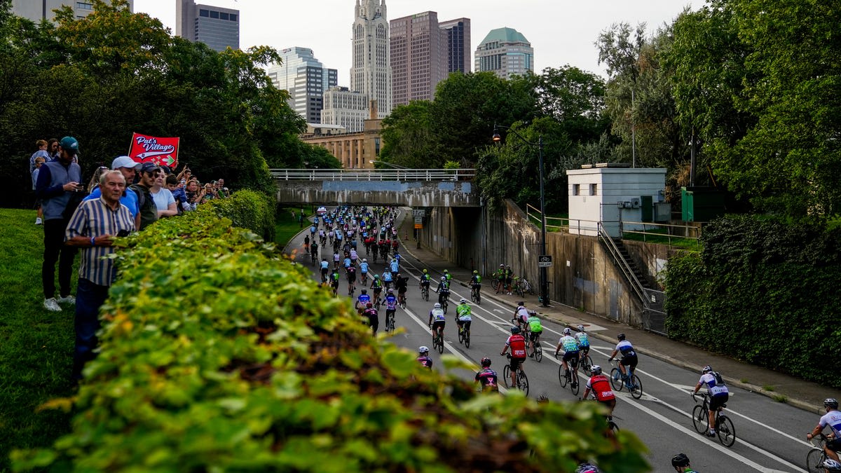 Cyclists in yellow jerseys riding together during Pelotonia charity event in Columbus Ohio
