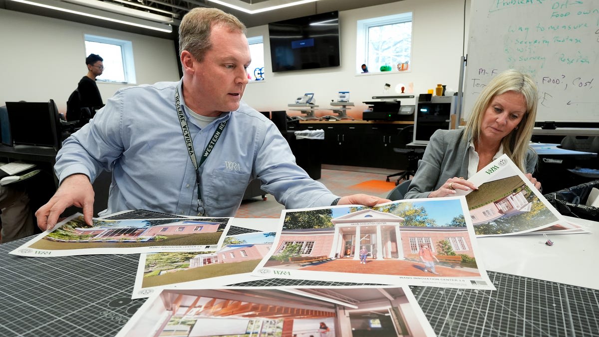 Students working with 3D printers and manufacturing equipment in Western Reserve Academy innovation center