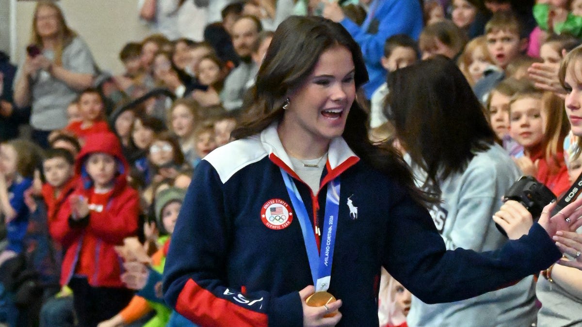 ** Boyne City Michigan residents celebrating Olympic gold medalist Kaila Kuhn at community event