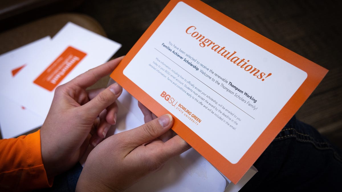 Diverse group of college students celebrating at Bowling Green State University scholarship announcement ceremony