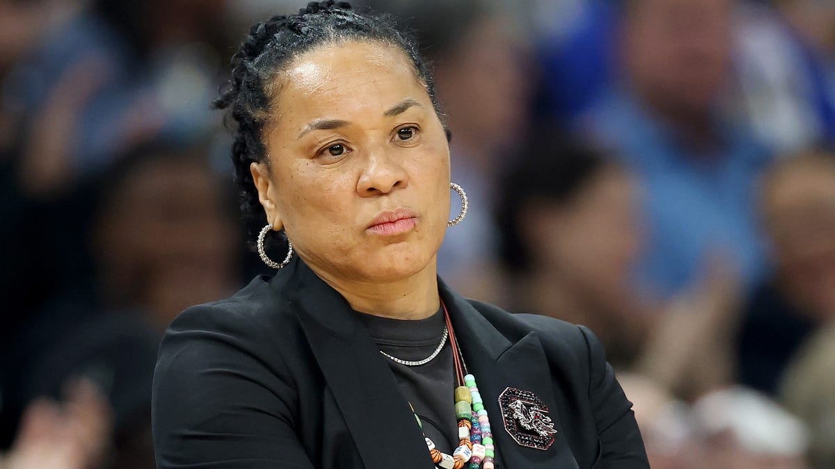 Dawn Staley celebrates with South Carolina women's basketball team after Final Four victory