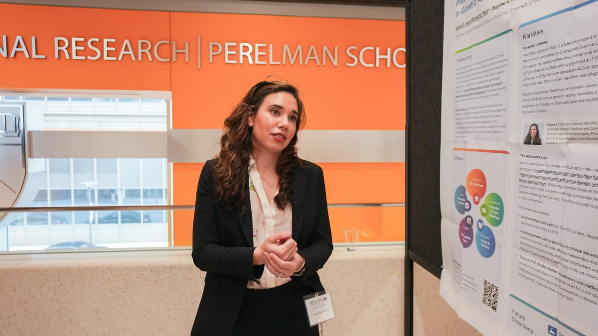 Medical student Yentli Soto Albrecht smiling in white coat at University of Pennsylvania campus