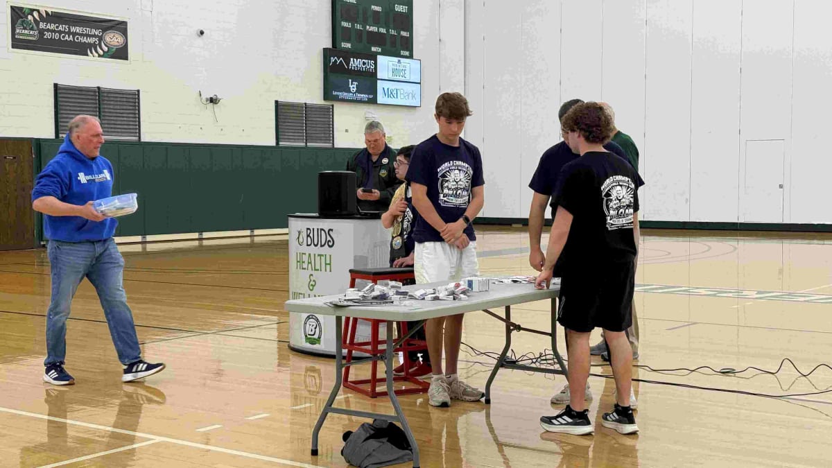 Binghamton University professor Bill Clark tearing through deck of cards setting world record
