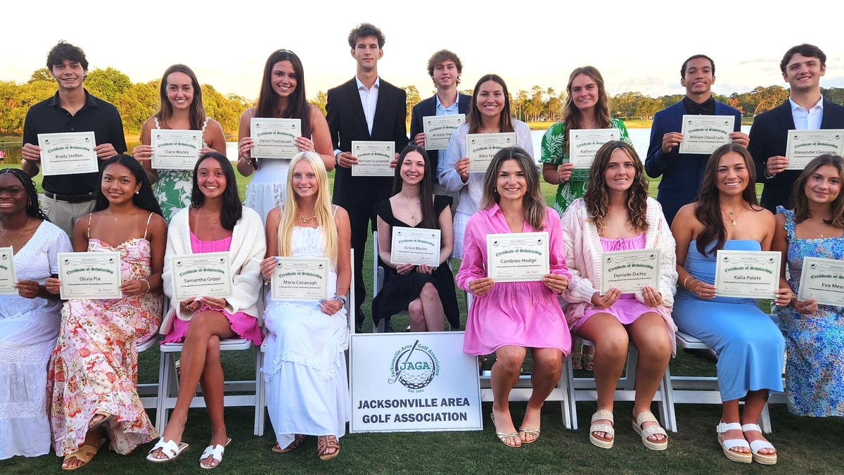 High school students celebrating scholarship awards at formal dinner ceremony in Jacksonville
