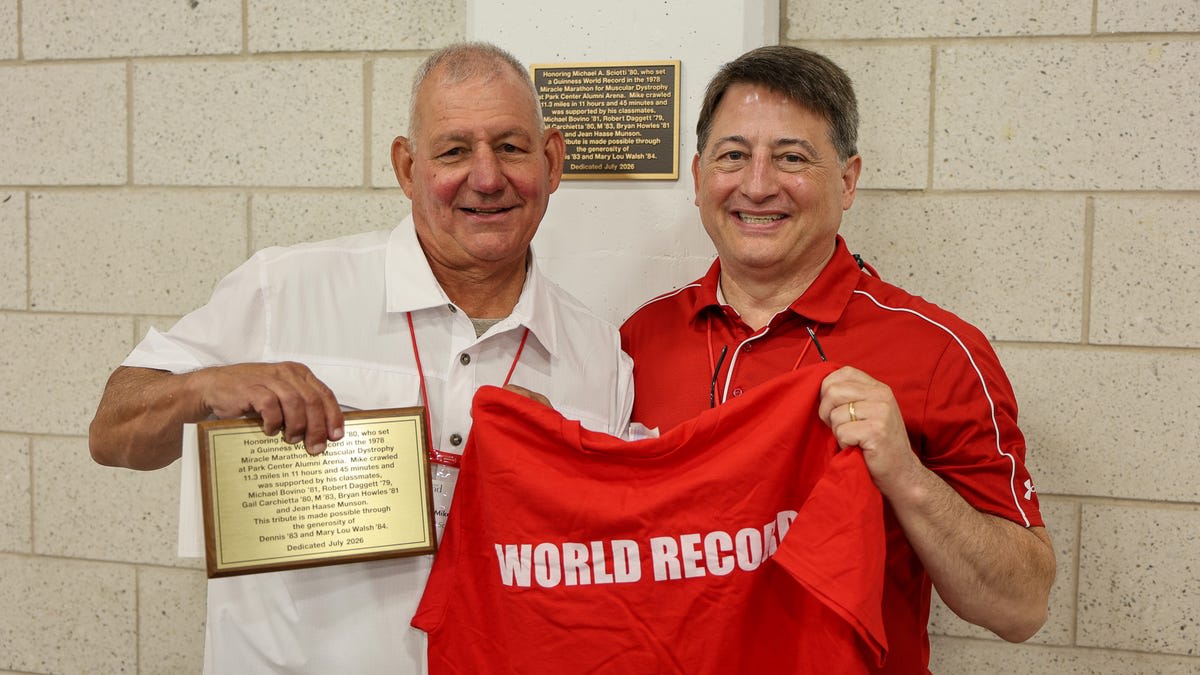 Historic plaque commemorating Mike Sciotti's 1978 world record crawling marathon at SUNY Cortland