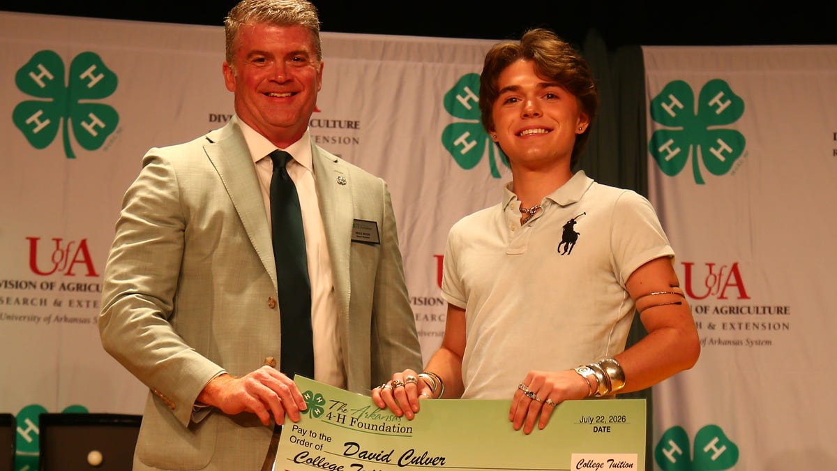Happy Arkansas 4-H scholarship recipients celebrating their college awards at State O-Rama ceremony